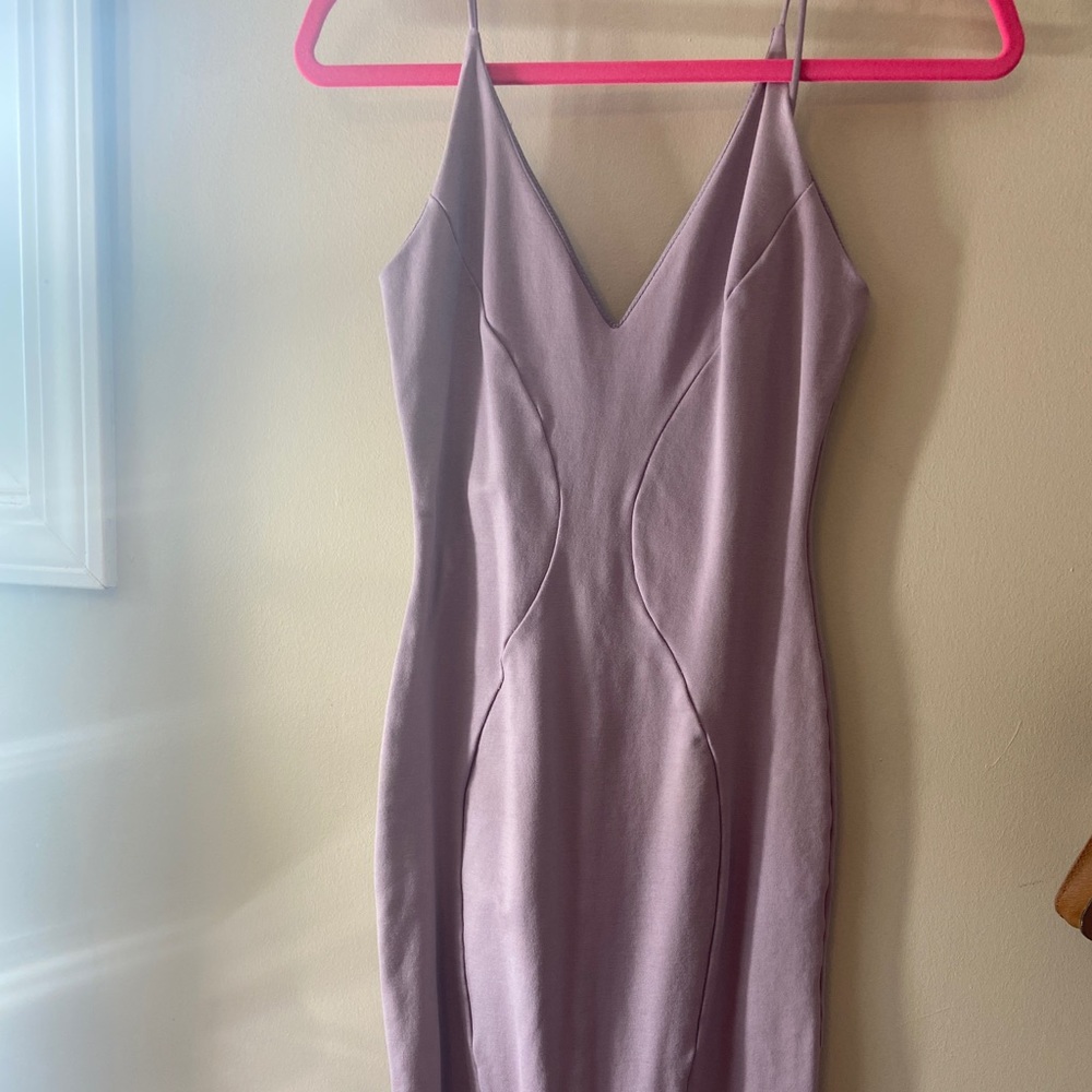 Brand new purple mini dress. Tight fit for a Large